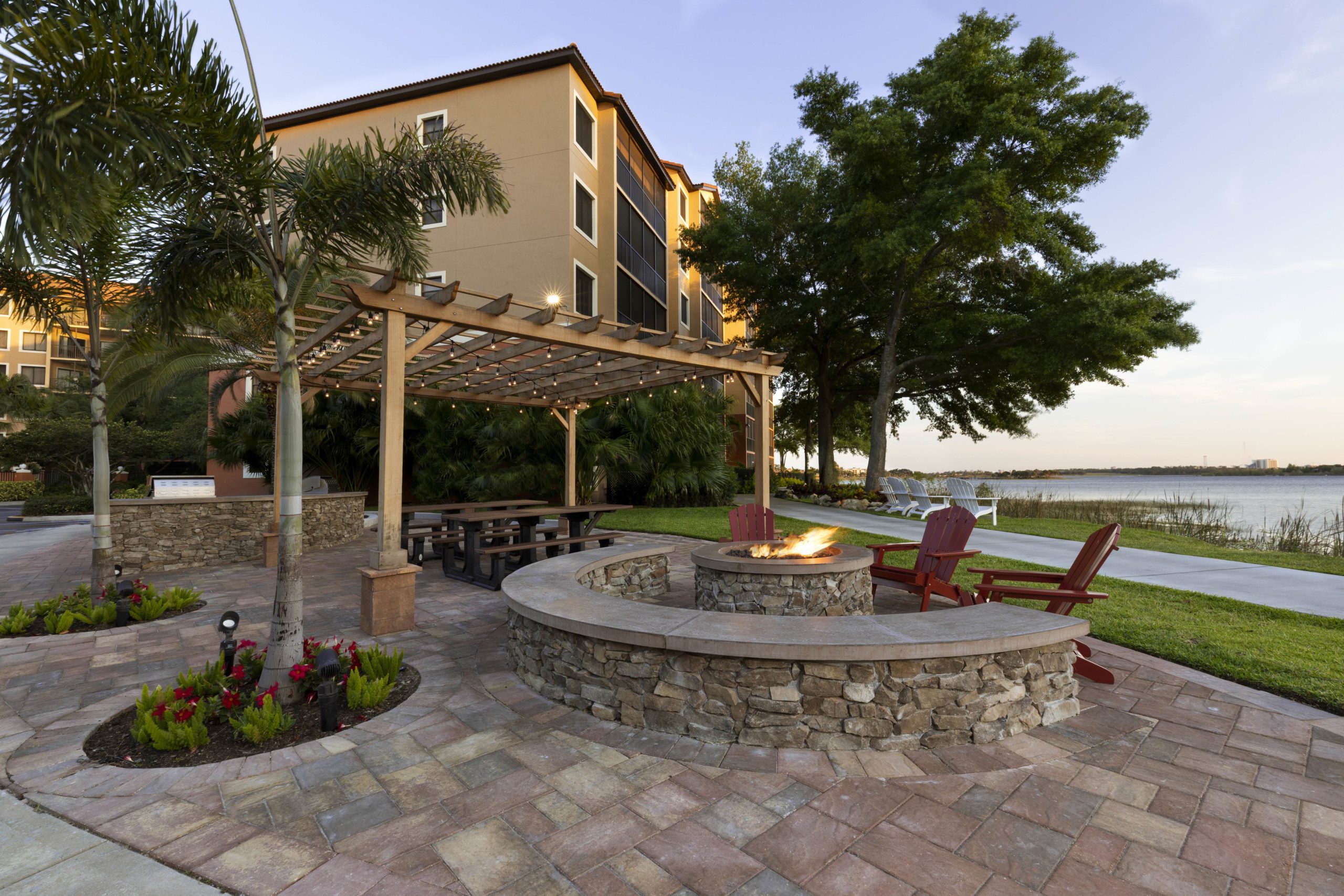 exterior of westgate lakes resort, nice waterfront seating area with firepit