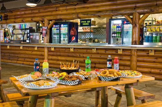 roaring fork grill bench with drinks and food at wild bear falls water park