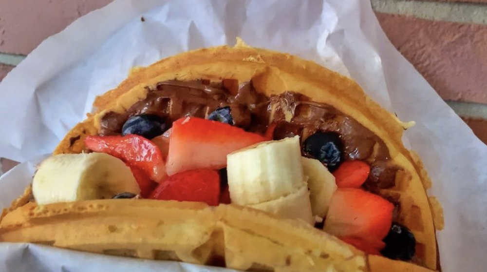 nutella waffle with blueberries, bananas, and strawberries