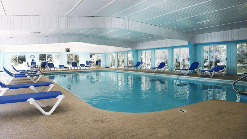 indoor pool at best western conference inn at center with pool chairs