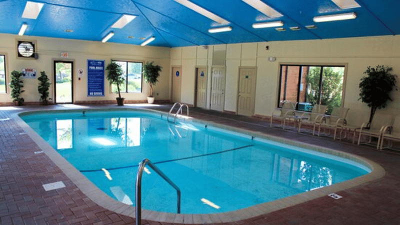 indoor pool at branson wood resort with blue ceiling and cream walls