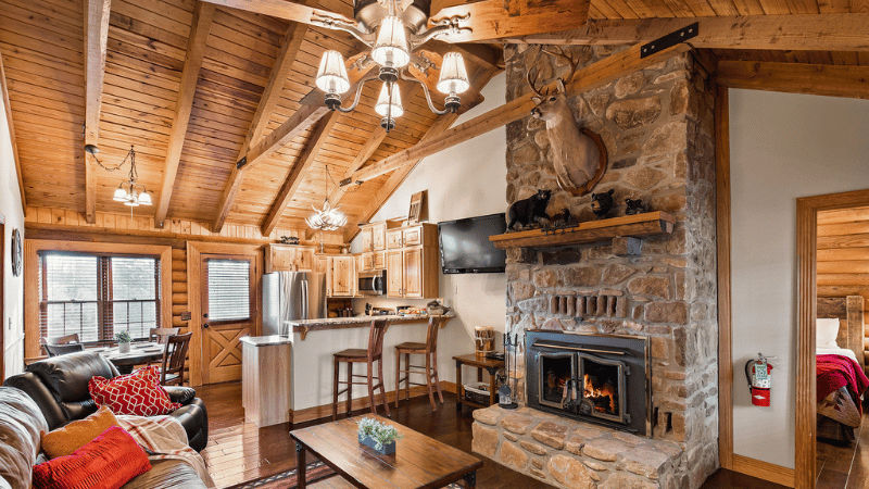 a hotel room with a fireplace and kitchenette