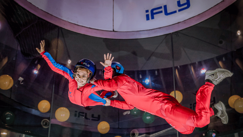 person and instructor sky diving inside at i fly orlando