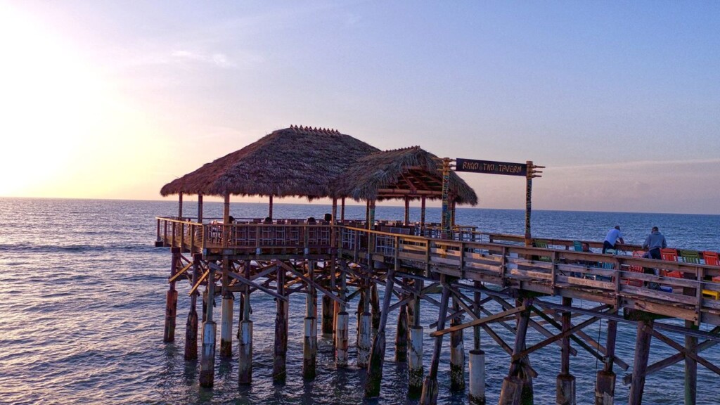 beautiful sunset at Rikki tikki tavern in Cocoa Beach Florida, the restaurant is over the water bungalow style