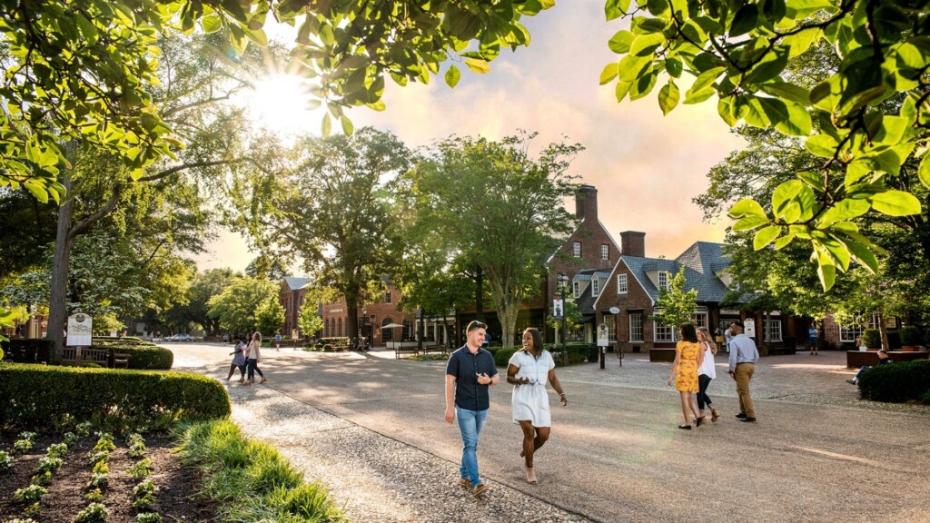 people walk in the street of merchant square during the day